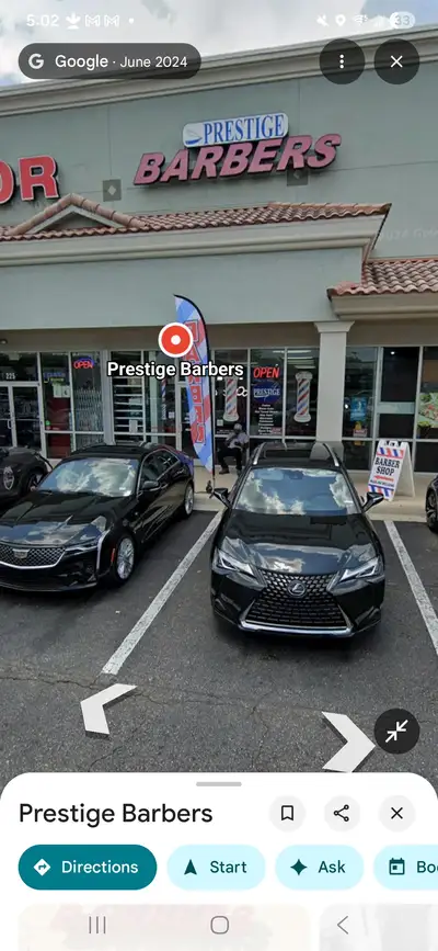 Prestige Barbers Atlantic Blvd storefront and entrance next to Golden Liquor